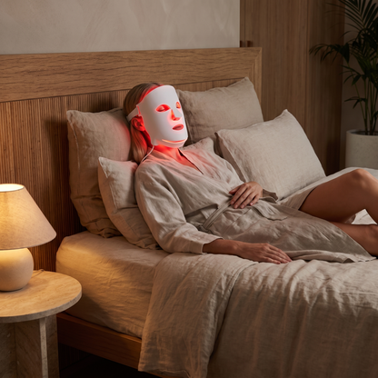 Omnitality Lumora Red Light Face Mask in a calm evening at-home routine
