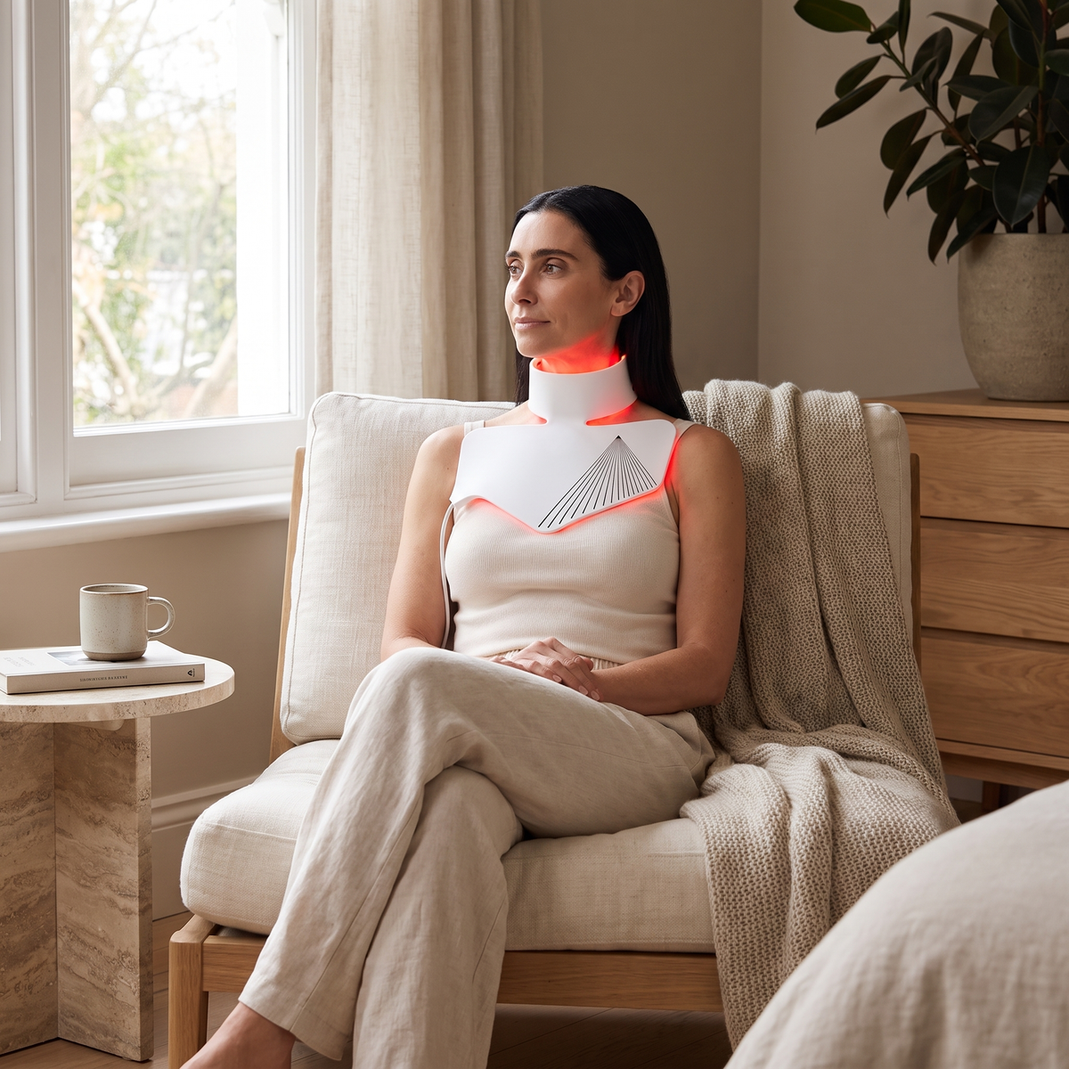 Omnitality NeckLume LED Neck and Décolletage Mask in a relaxed at-home wellness routine